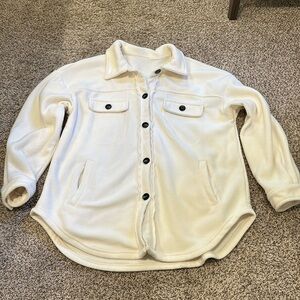 Size medium fleece shacket with black marble buttons.